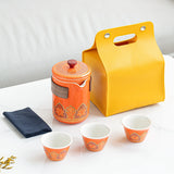 Orange tea set with matching carrying case