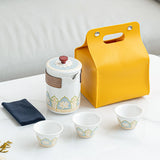 White tea set with a yellow carrying case
