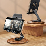 Wooden phone stand with adjustable arm on a wooden surface
