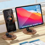 Wooden desk stand holding a smartphone and tablet on a desk with a window in the background