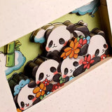 Panda-themed product packaging with cartoon pandas and flowers on a colorful background
