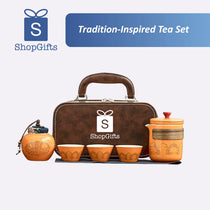 Tea set with brown carrying case and orange teacups, featuring ShopGifts logo.