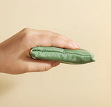 Hand holding a folded All-Purpose Reusable Grocery Bag