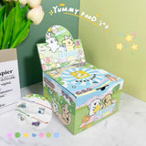 Colorful cartoon-themed box with a lid open, displaying cute illustrations on a light green background.