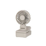 Small beige fan on a white background