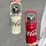 Sporty stainless steel vacuum bottle featuring the iconic Coca-Cola branding.
