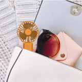 Hexagon-shaped USB fan with built-in phone stand, compact design for desktop use