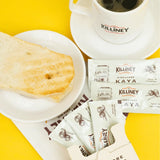 Killiney Singapore Kaya Coconut Jam placed next to breakfast bread and coffee.