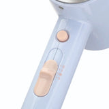 Light blue hair dryer with beige accents on a white background