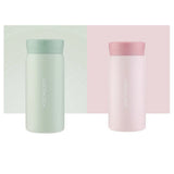 Two Lock&Lock insulated bottles, one green and one pink, on a white background.