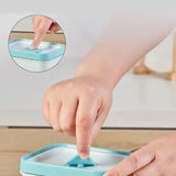 Person using a blue kitchen tool with a close-up of the tool's surface.