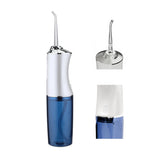 Blue and silver dental water flosser on a white background