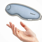 OSIM eye mask held by a hand on a white background