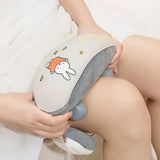 Person holding a cartoon plush toy with a neutral background