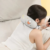 Person using a neck and shoulder massager with cartoon character design on a couch.