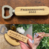 Wooden bottle opener with engraved text on a wooden surface, held by a hand, and in a natural setting.