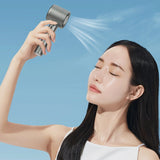 Woman using the fan