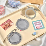 Silver 360 Degree Rotating Ring Phone Stand with textured finish on a smartphone back_ Gift Shop