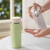 Sage green and white Modular 4-in-1 Rotating Travel Dispenser with four refillable 40ml liquid bottles _ corporate gift