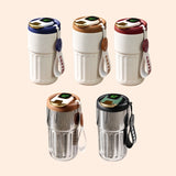 Cream and silver 450mlSmartTemperatureCoffeeTumbler with LED lids and leather straps on a wooden surface. Gift SHop