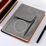 Grey Suede A5 Executive Notebook with external pocket and pen holder on a minimalist desk_corporate door gift