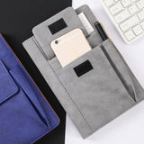 Grey Suede A5 Executive Notebook with external pocket and pen holder on a minimalist desk_corporate door gift