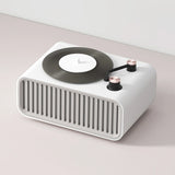 Minimalist EZVALO aroma diffuser and Bluetooth speaker in office setting