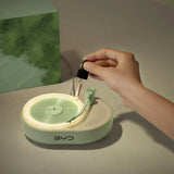 Bluetooth aroma diffuser speaker placed on a wooden desk