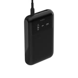Belkin 65W Multi-Port Laptop Power Bank in matte black finish charging a laptop and smartphone_ Customised Corporate Gift.