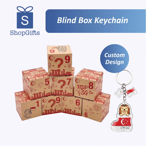 Stack of blind box keychains with a custom design keychain featuring a lion and Singapore flag.