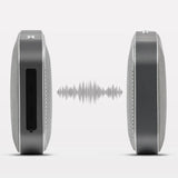 Two cylindrical speakers with a sound wave between them