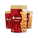 Three packages of Camel Cashews on a white background