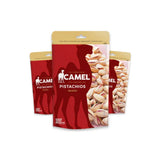Three packages of Camel Pistachios on a white background