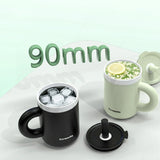 Two mugs, one black and one white, with ice cubes and a lemon slice on a light green background.