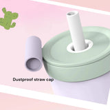Green straw lid with a white straw on a pink background