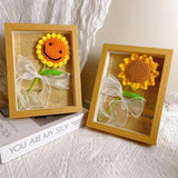 Handmade yellow crochet sunflower in a wooden shadow box frame with a white ribbon bow_Corporate Door Gift