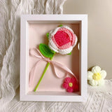 Handmade red crochet flower in a wooden shadow box frame with a white ribbon bow_Corporate Door Gift