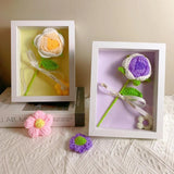 Handmade yellow & purple crochet flower in a wooden shadow box frame with a white ribbon bow_Corporate Door Gift