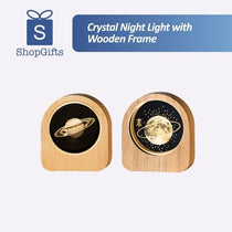 Celestial 3D Engraved Crystal Mood Lamp with space scene in a wooden frame on a desk_ corporate gift supplier