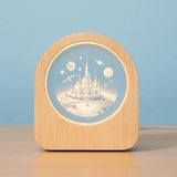 Celestial 3D Engraved Crystal Mood Lamp with space scene in a wooden frame on a desk_ corporate gift supplier