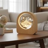 Celestial 3D Engraved Crystal Mood Lamp with space scene in a wooden frame on a desk_ corporate gift supplier