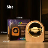 Celestial 3D Engraved Crystal Mood Lamp with space scene in a wooden frame on a desk_ corporate gift supplier