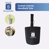 Black custom canvas handheld tote with ShopGifts logo on a white background