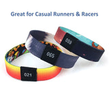 Vibrant Premium Custom Sublimated Elastic Wristband with numbered tag on a runner's wrist_ corporate gift