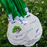Eco-friendly plantable seed paper medal with green lanyard for sustainable corporate events and awards_ corporate gifts