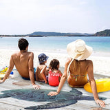 Oversized waterproof picnic mat with sea turtle design, ground stakes, and mesh carry bag for beach outings_ Corporate Gifts Singapore