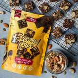Packaged brownie crisp with Dan's Bites branding on a blue surface with snacks around