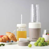 THERMOS blender with fruits, packaging, and additional components on a white background