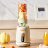 THERMOS blender with fruits inside on a wooden surface