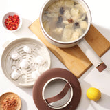 Stir-fry pan with ingredients on a white background